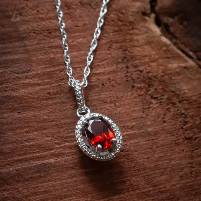 Confidence and Strength: Garnet and Diamond Halo Style Necklace